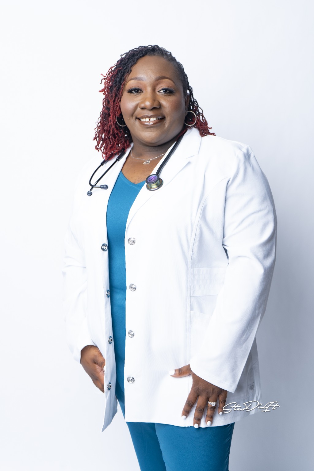 Dr. Penny Walker wearing a white medical coat